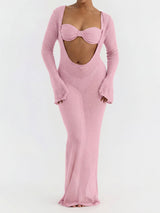 woman wearing a pink sheer knit maxi dress with a cut-out detail and long sleeves