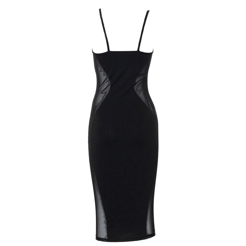 Back view of a black midi dress with sheer mesh side inserts.