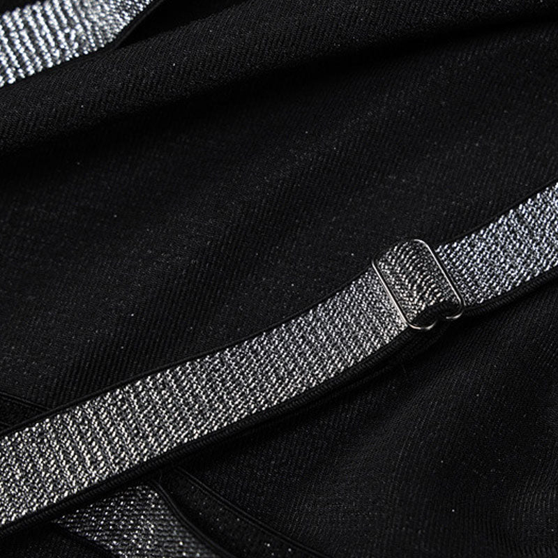 Close-up of the sparkling glitter strap detail on a black gown