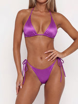Model wearing a purple satin triangle bikini set with adjustable ties