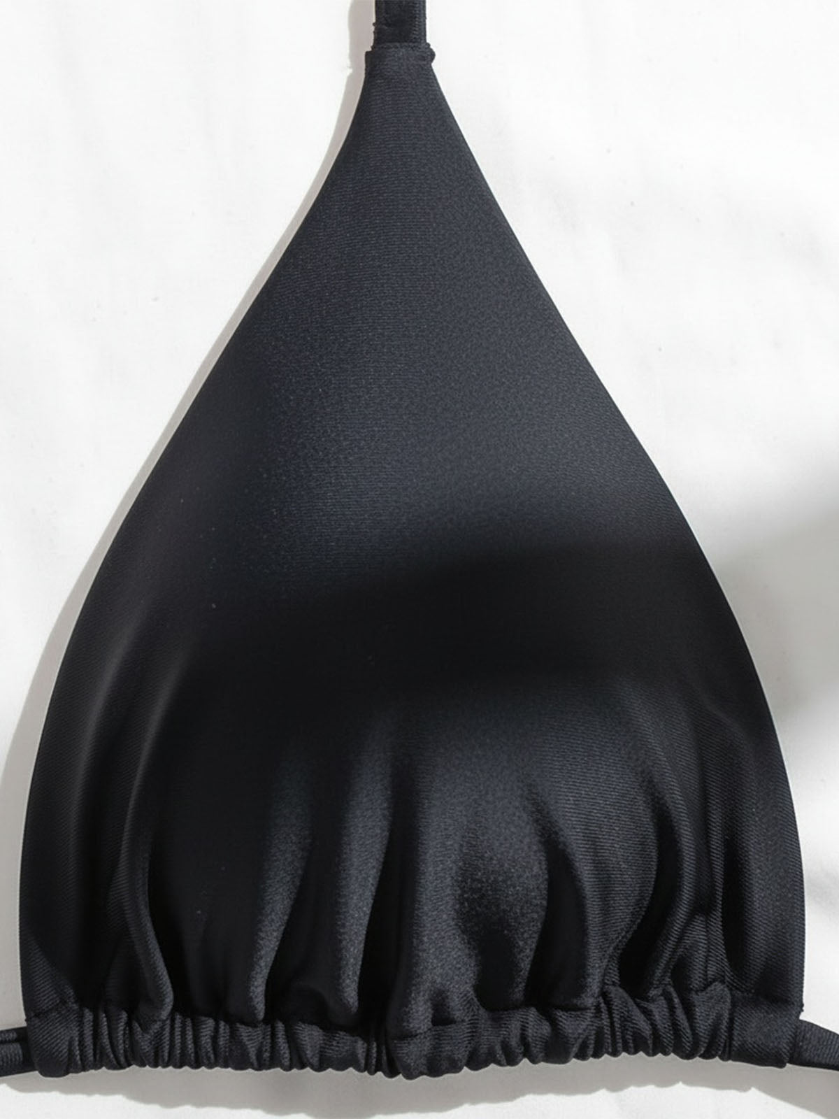 Close-up of the black bikini top