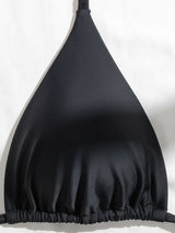 Close-up of the black bikini top