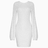 front view of a white sequined mini dress with long bishop sleeves
