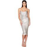 Woman wearing a silver sequined midi dress with spaghetti straps, front view.