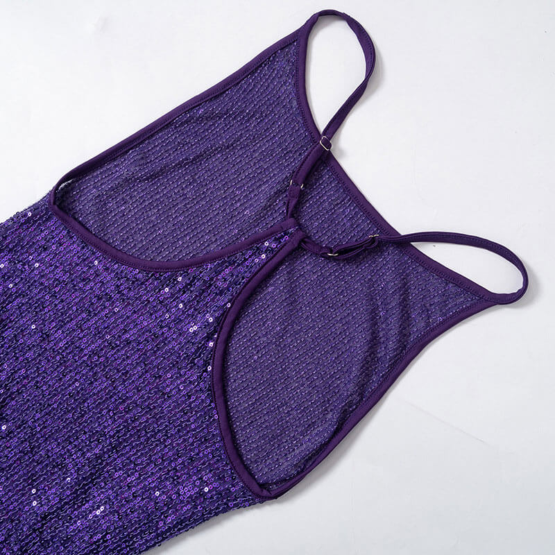 Close-up of the back of a purple sequined dress, showing adjustable spaghetti straps and the sequined fabric.
