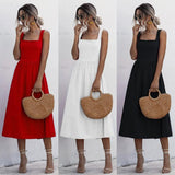Woman wearing a red sleeveless square neck midi dress with a fitted bodice and A-line skirt.