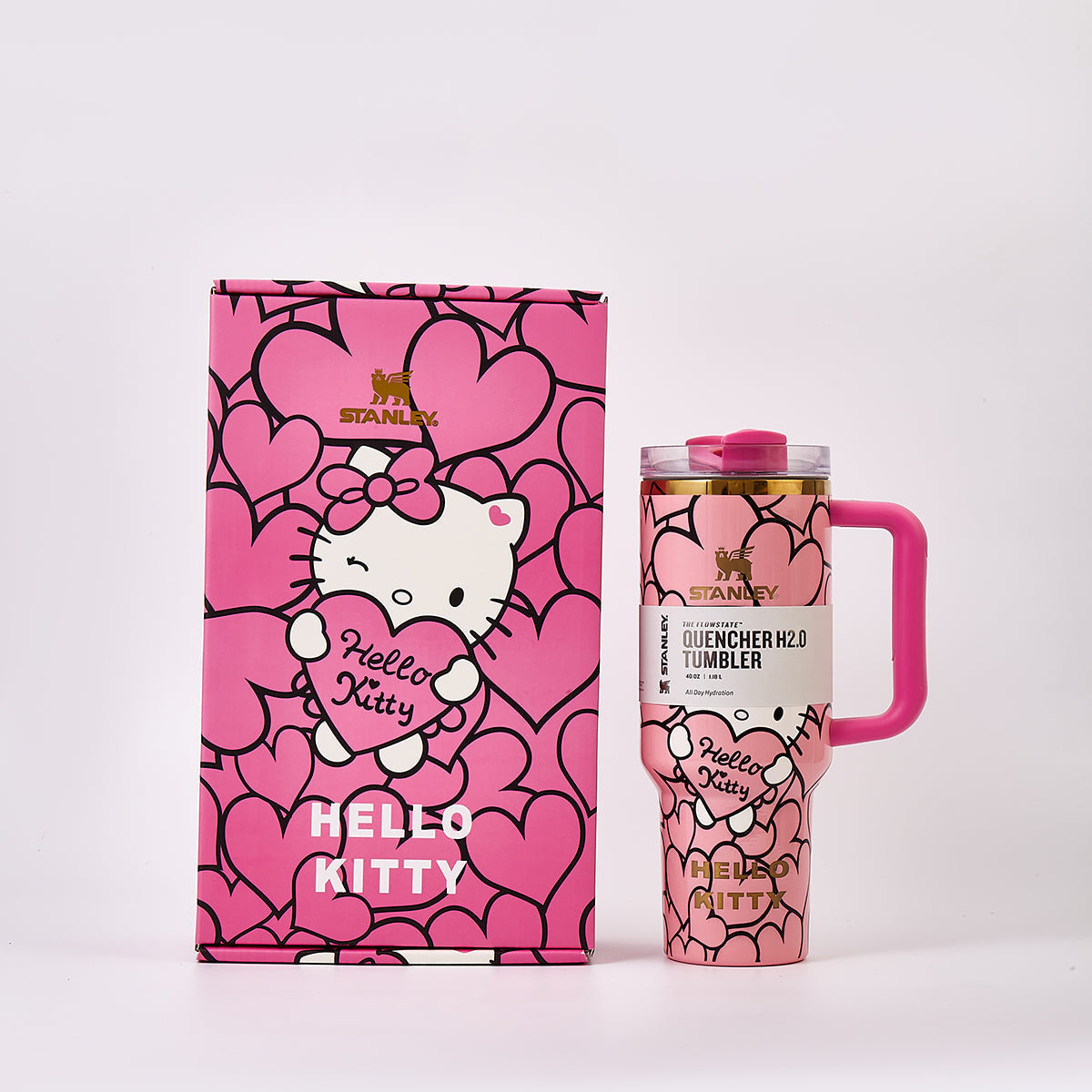 Stanley x Hello Kitty Quencher H2.0 Tumbler in pink next to its matching gift box