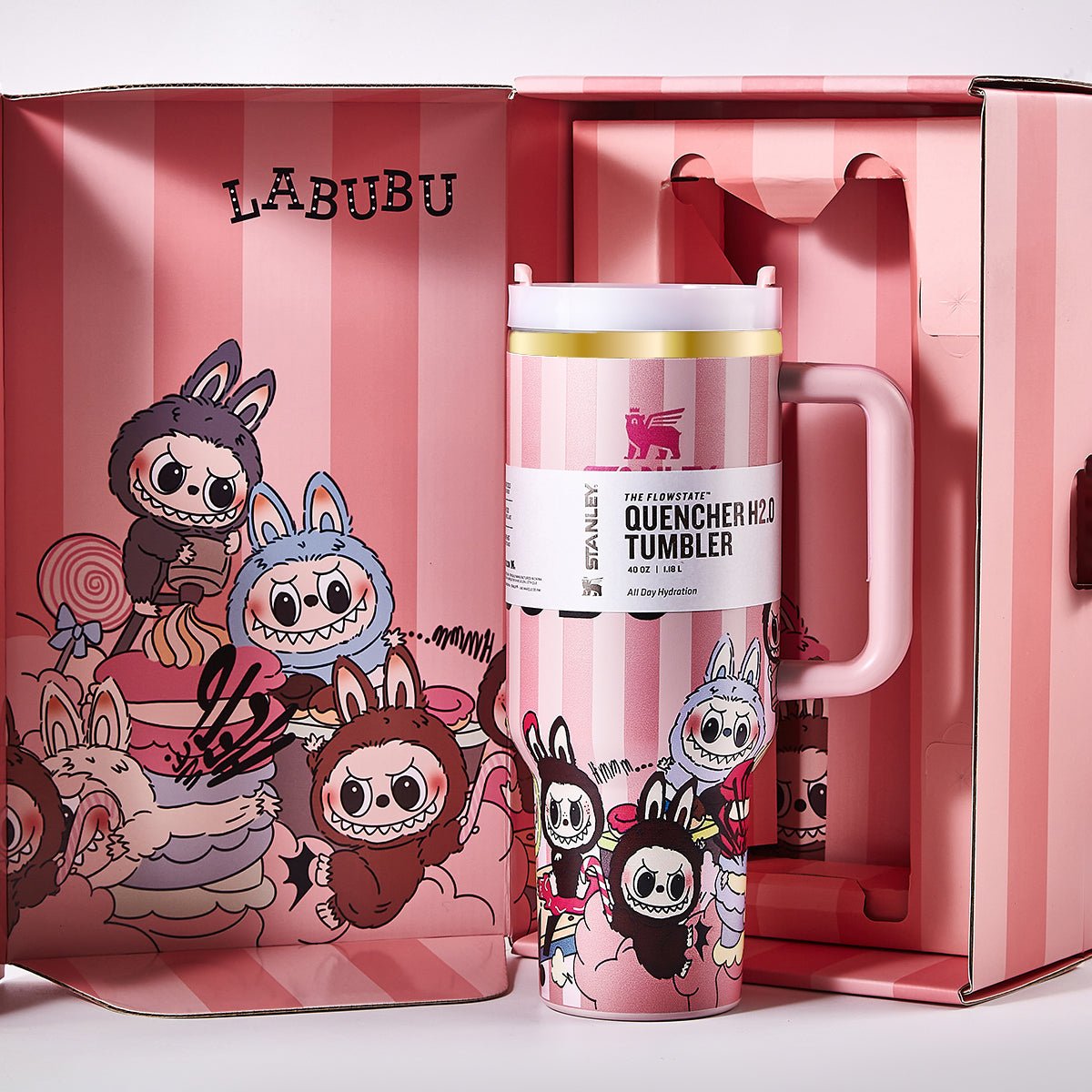 The Stanley x Labubu Quencher H2.0 Tumbler and its open packaging, revealing the pink striped interior and the tumbler's design.