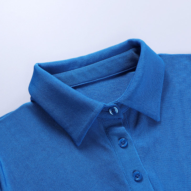 Close-up of the collar and buttons on a blue shirt dress
