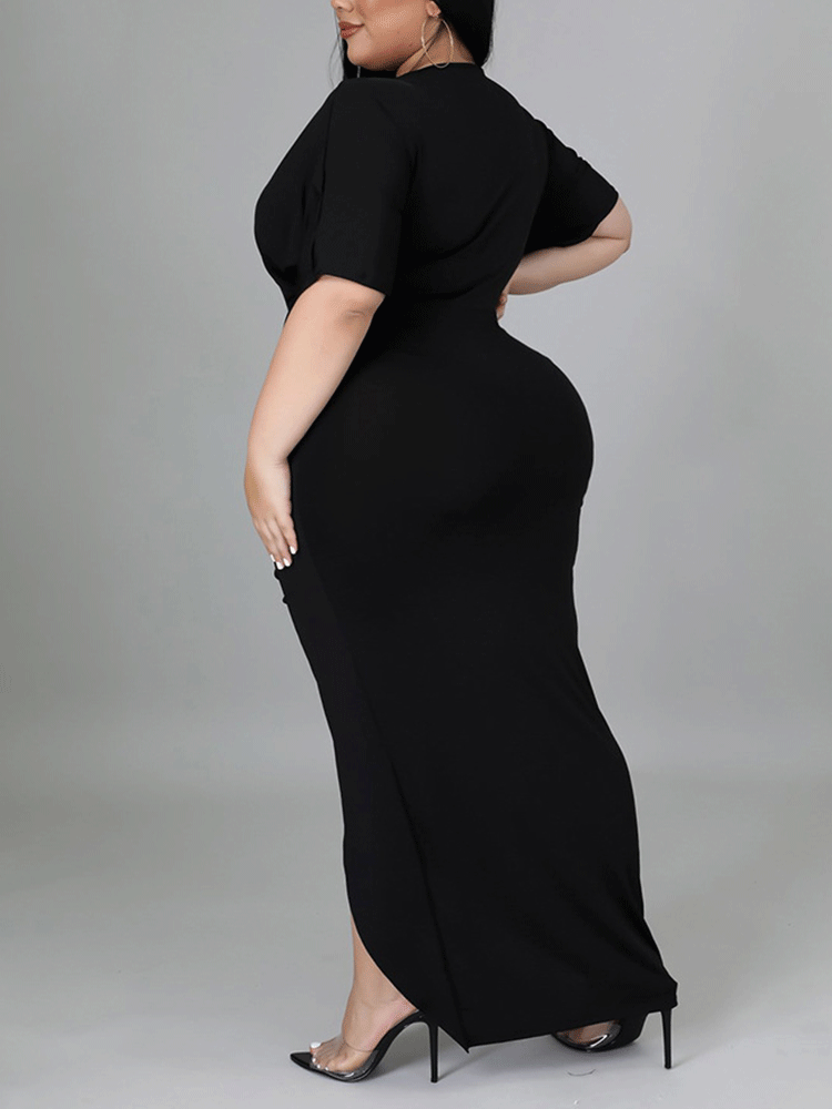 Back view of a woman in a black maxi dress