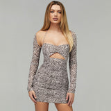Woman wearing a long-sleeved ruched mini dress with an animal print pattern and a cut-out detail.