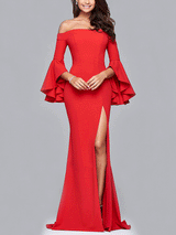 Full-length view of a woman in a red off-the-shoulder mermaid gown with bell sleeves and a high slit, against a gray background.