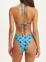woman wearing a light blue bikini with a brown floral print, back view