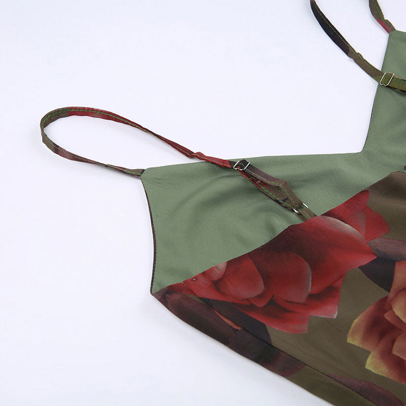 Close-up of the adjustable spaghetti straps on a floral print midi slip dress.
