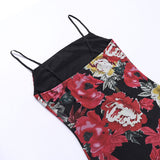 close-up of the fabric and straps of a black floral print mini dress
