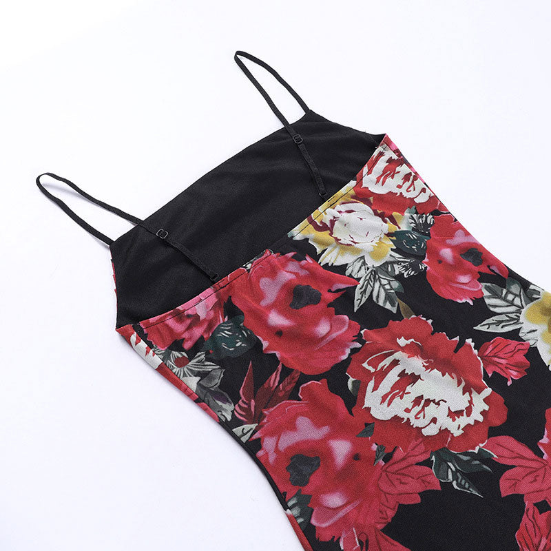 close-up of the fabric and straps of a black floral print mini dress