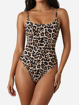 Front view of a woman wearing a leopard print one-piece swimsuit with a scoop neckline and spaghetti straps.