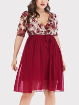 Plus size women's short sleeve floral print lace wrap dress with A-line skirt in burgundy