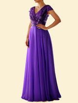 Woman wearing a purple sequined formal dress with a flowing skirt