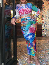 Close-up of the graffiti print on a woman's long-sleeved dress.