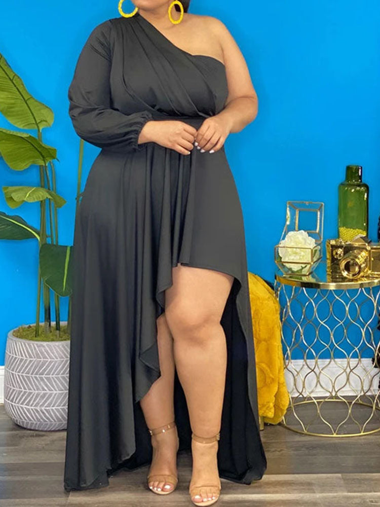 woman wearing a black one-shoulder high-low maxi dress, front view